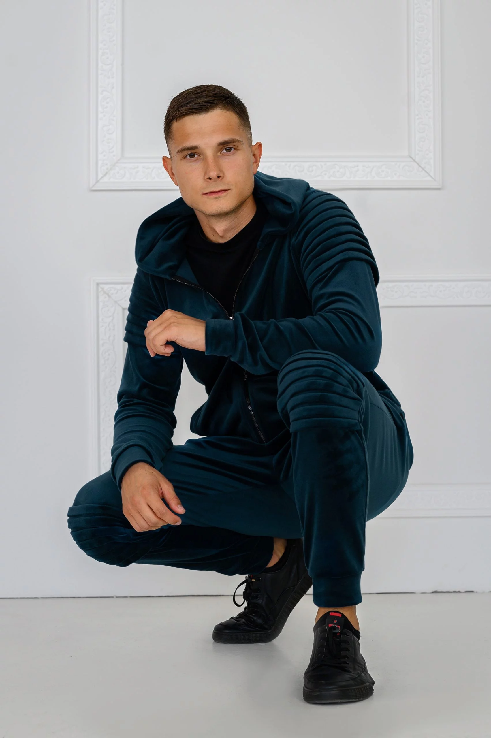 Emerald velour tracksuit with pleats (and a hood)